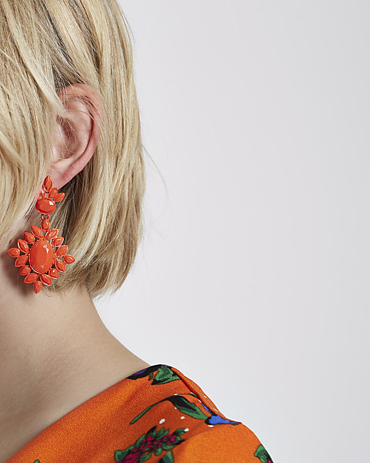 Orange jewel encrusted drop earrings