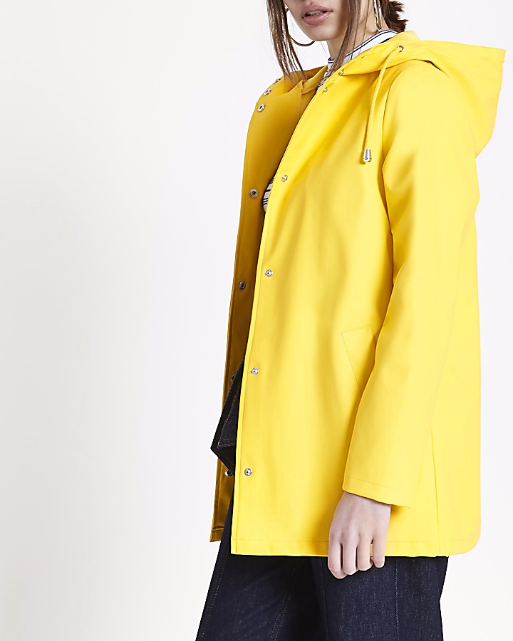 Yellow waterproof hooded rain mac