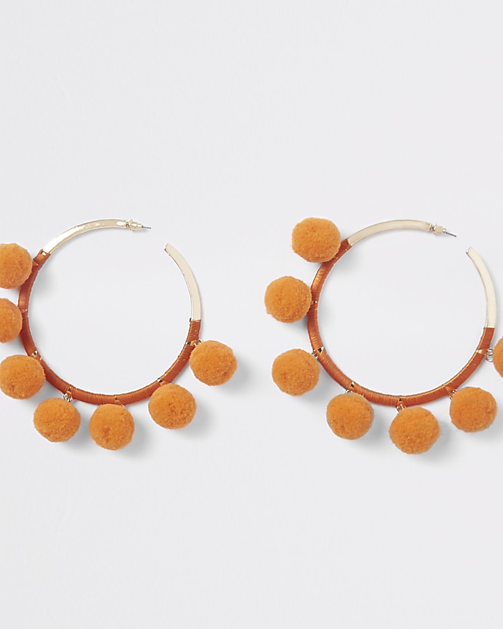 Orange gold tone pom pom hoop earrings