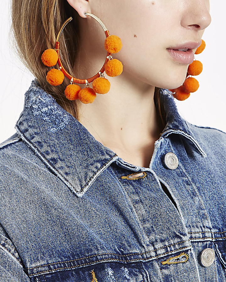Orange gold tone pom pom hoop earrings