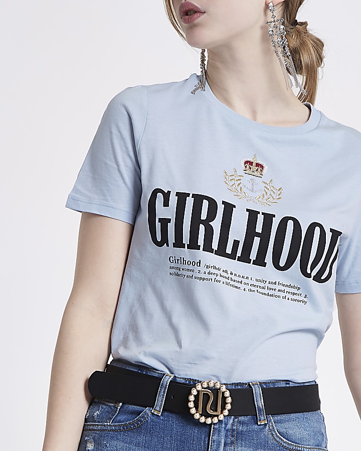 Light blue ‘girlhood’ crest embroidered top