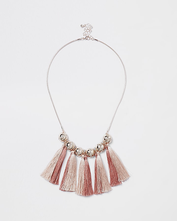 Gold tone pink tassel and diamante necklace