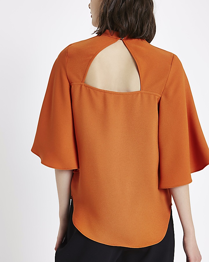 Orange cape sleeve top