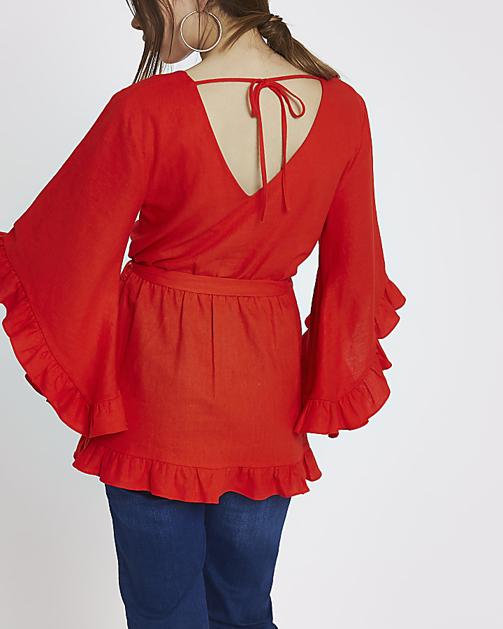 Red wrap front frill tie waist top