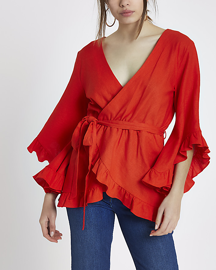 Red wrap front frill tie waist top