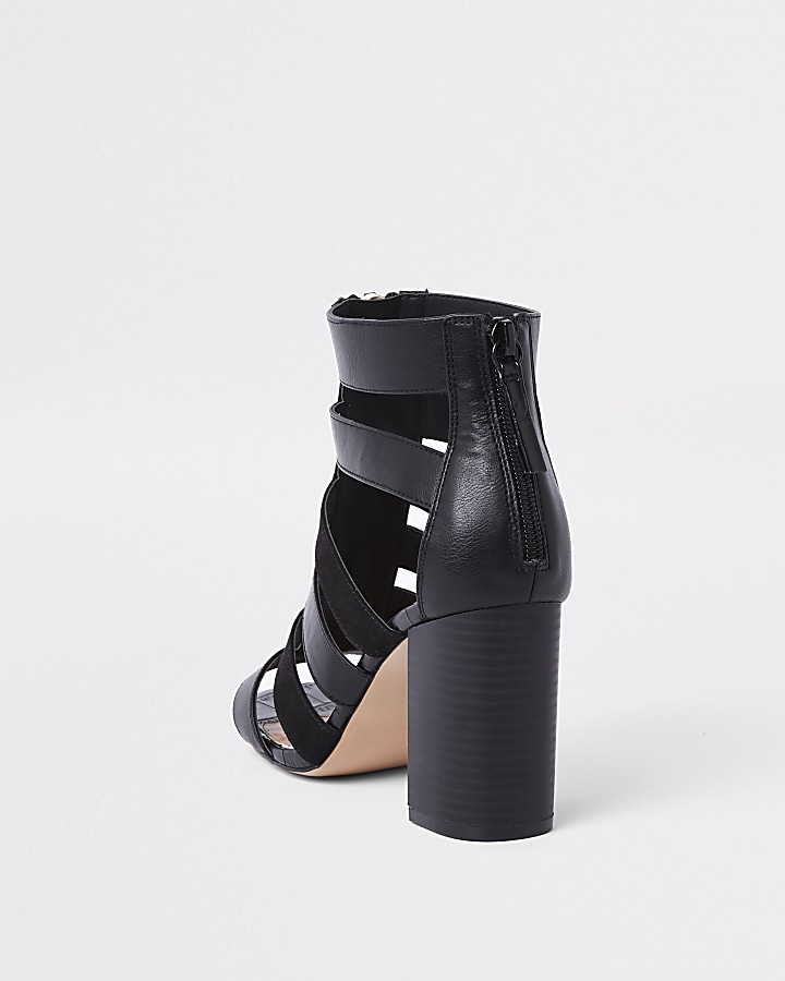 Black caged block heel shoe boots