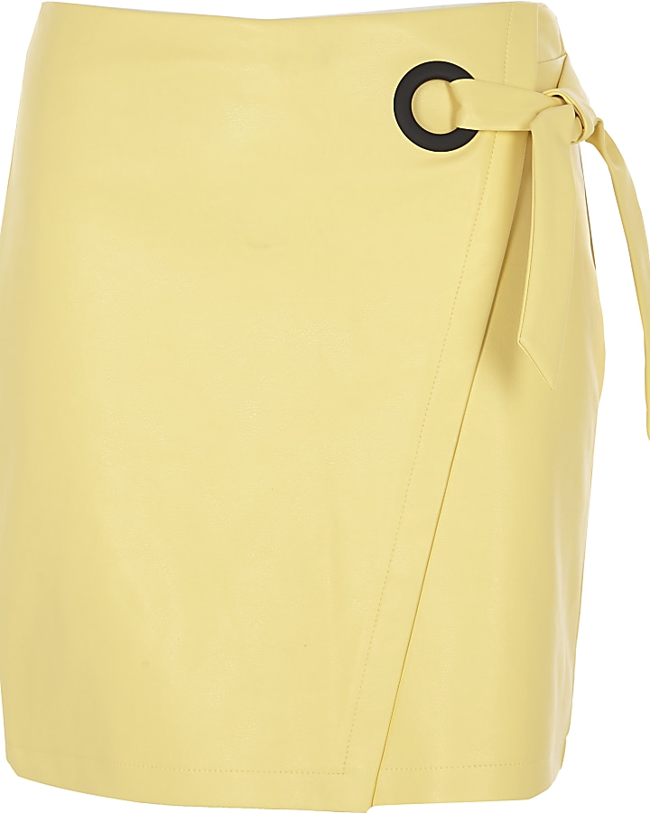 Yellow wrap eyelet tie-up mini skirt