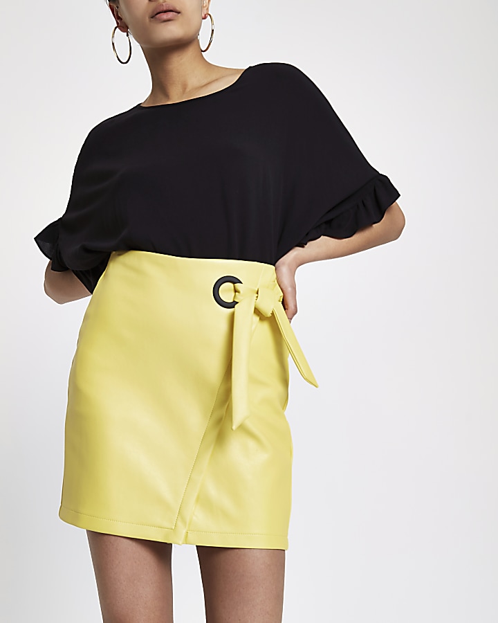 Yellow wrap eyelet tie-up mini skirt