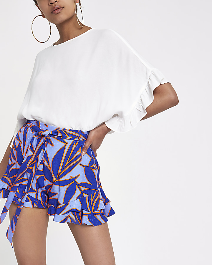 Blue tropical print frill hem shorts