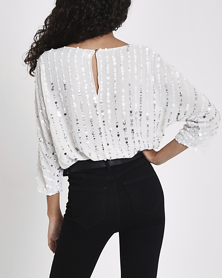 White sequin batwing top