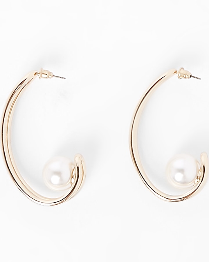 Gold tone pearl curve earrings