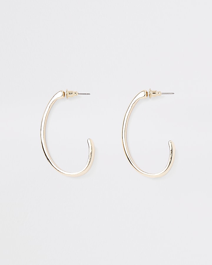 Gold tone small oval hoop earrings