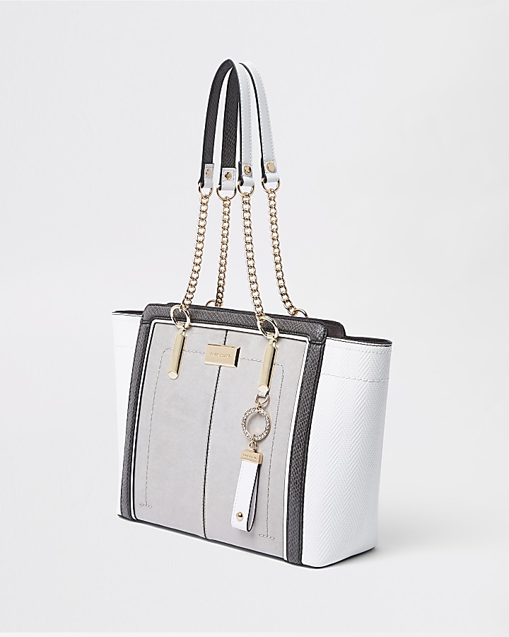 Light grey winged chain handle tote bag