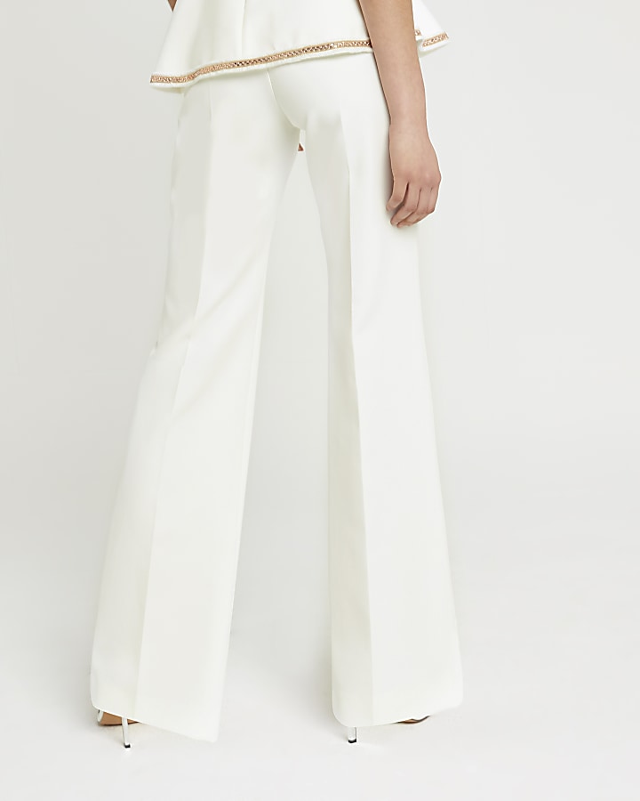 White embellished wide leg trousers
