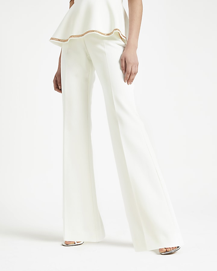 White embellished wide leg trousers