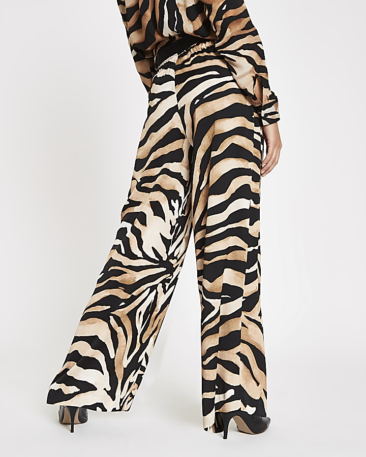 Brown wide leg tiger print trousers