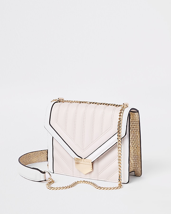 Pink and white quilted cross body bag