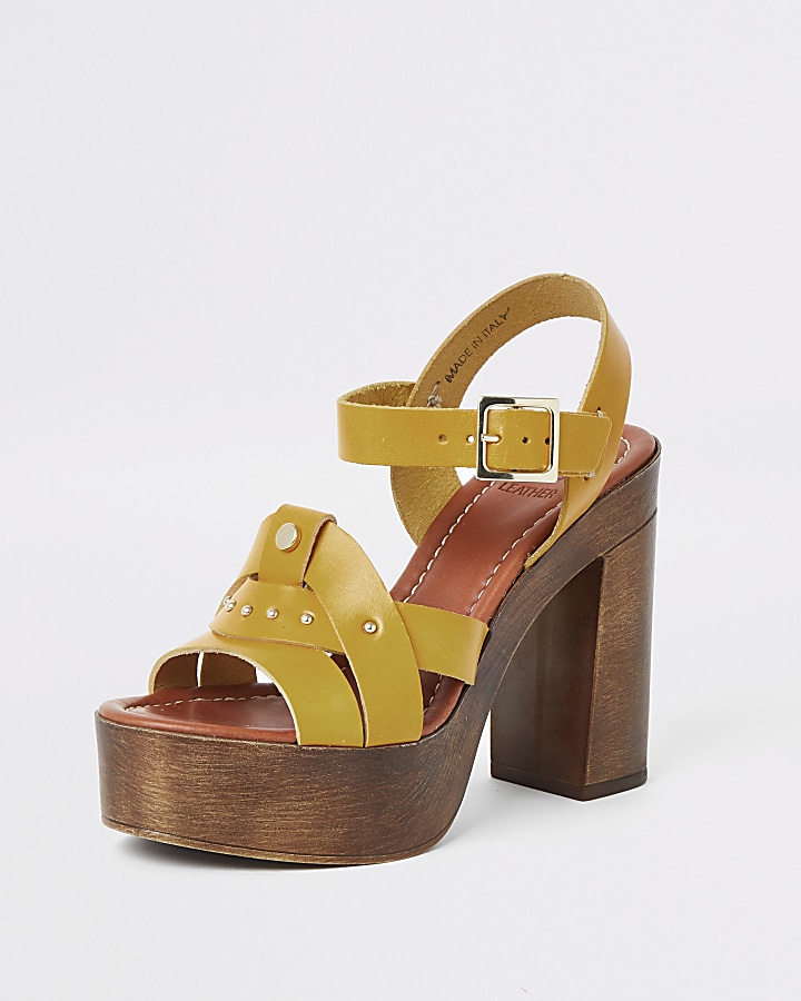 Yellow leather studded platform heels