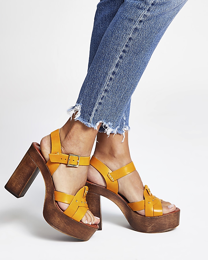 Yellow leather studded platform heels