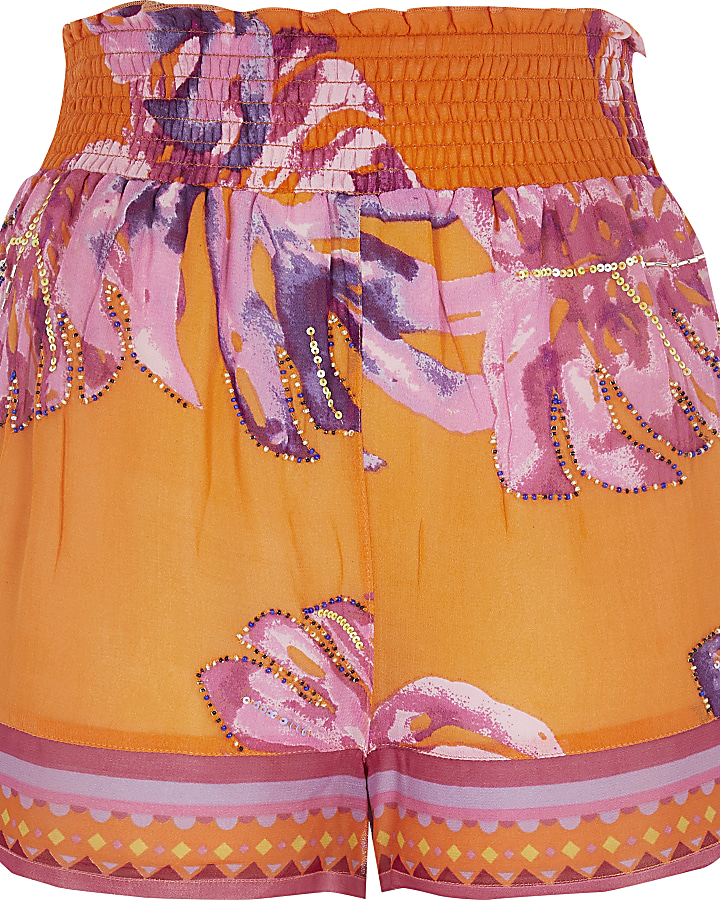 Orange floral beach shorts