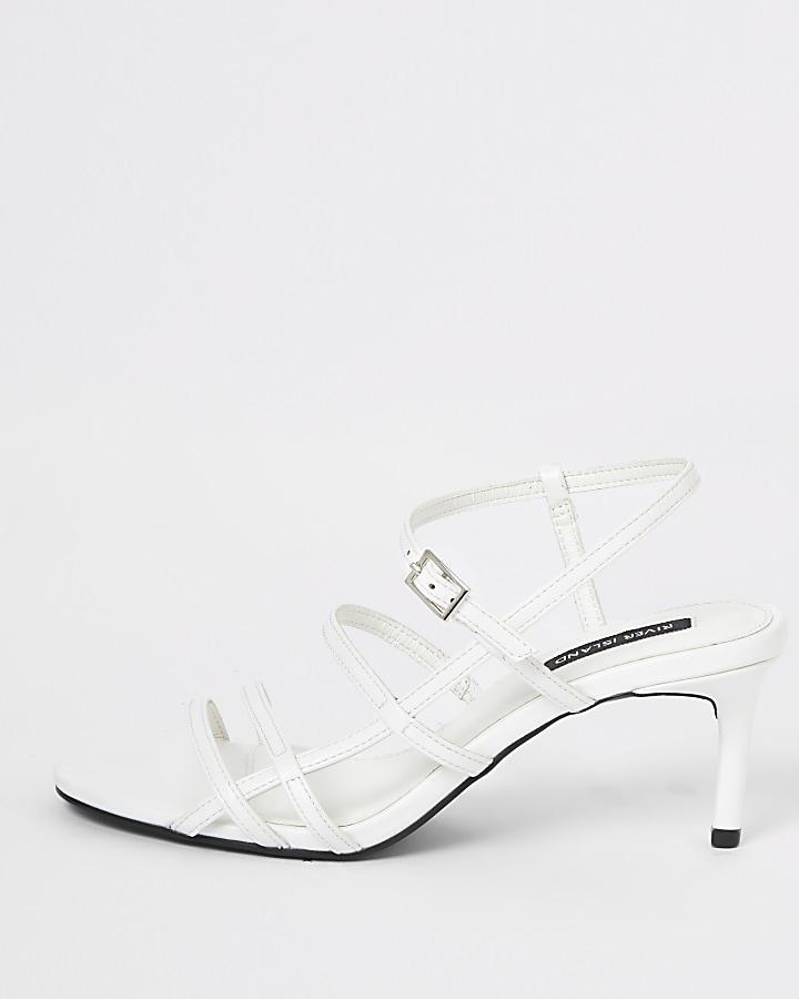 White caged skinny heel sandals