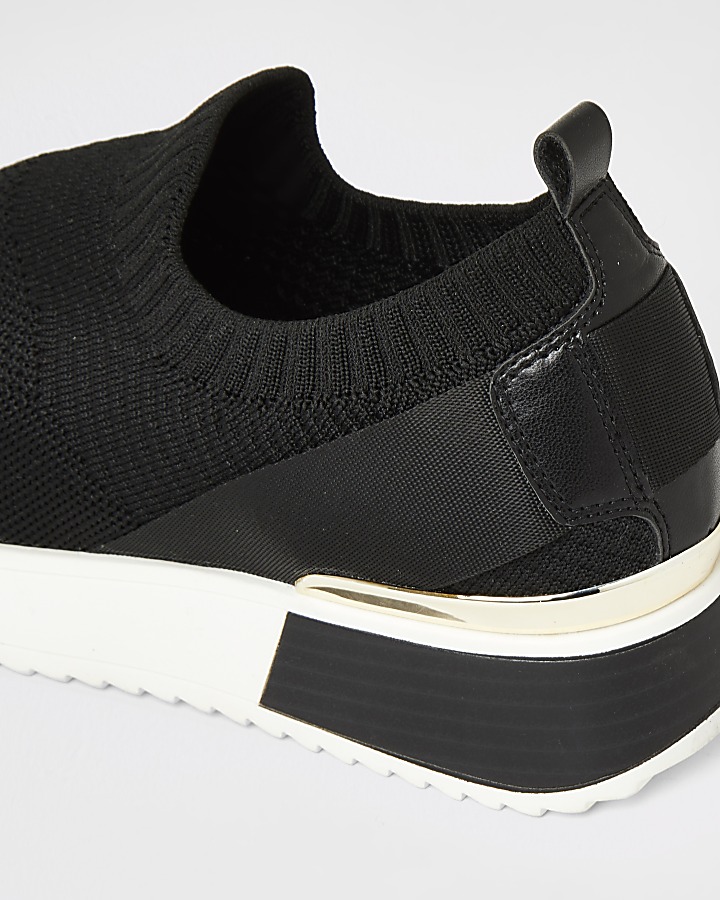 Black knitted runner trainers