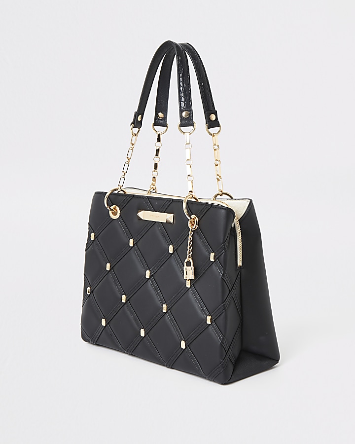 Black quilted studded tote bag