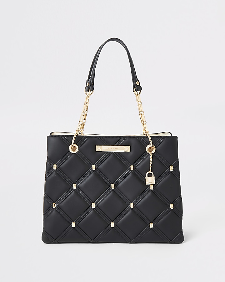 Black quilted studded tote bag