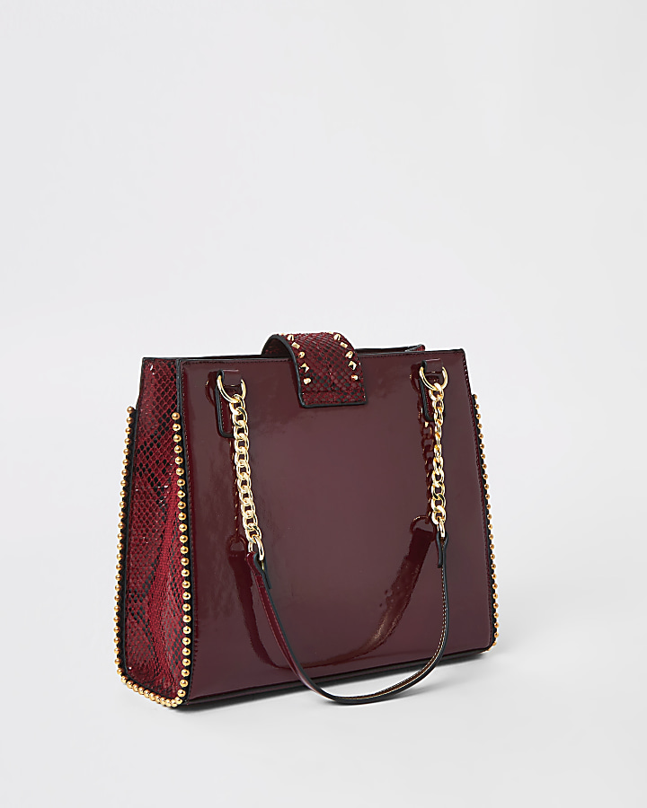 Red studded tote bag