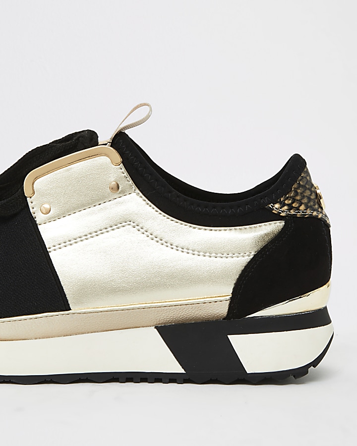 Gold elasticated lace-up runner trainers