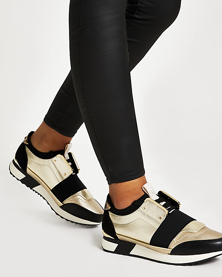 Gold elasticated lace-up runner trainers