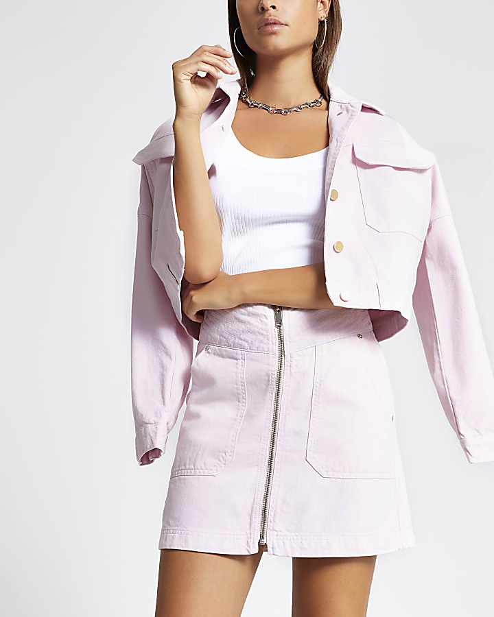 Light pink zip front mini denim skirt