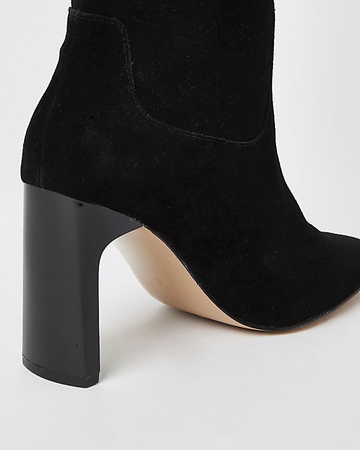 Black suede knee high heeled boots