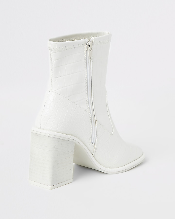 White croc embossed heeled ankle boots