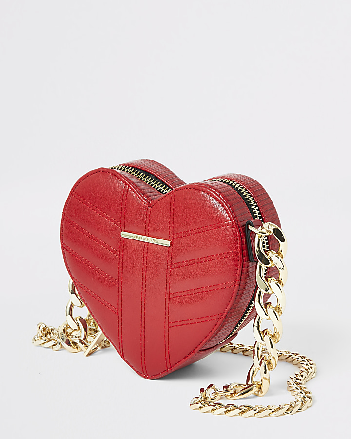 Red quilted heart shaped cross body bag