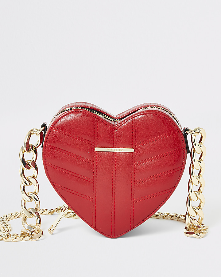 Red quilted heart shaped cross body bag
