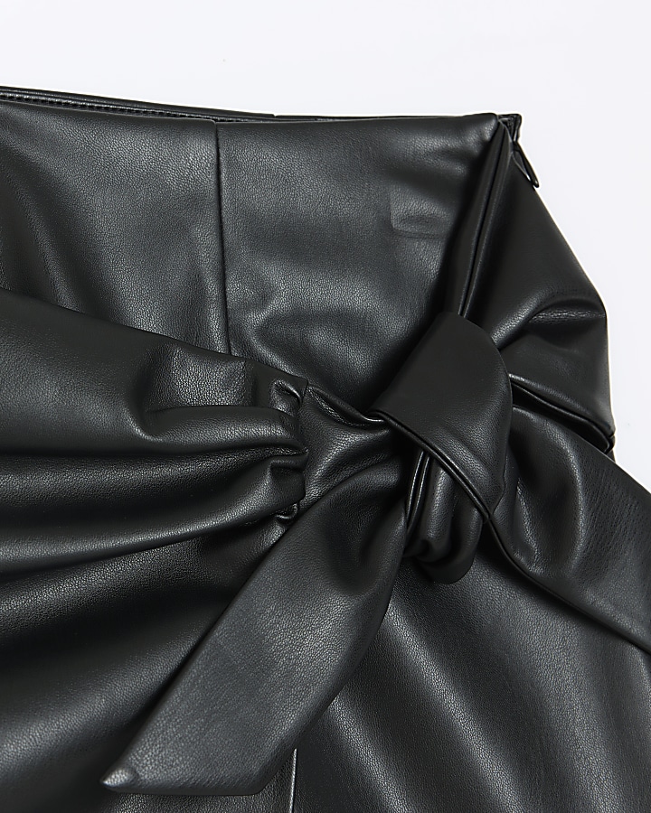 Black faux leather bow mini skirt