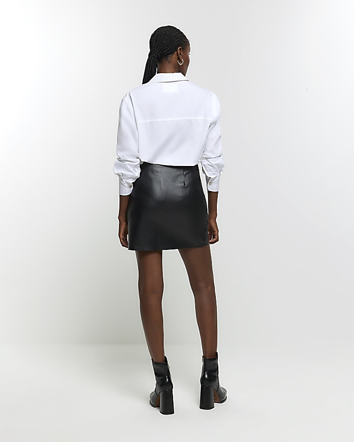 Black faux leather bow mini skirt