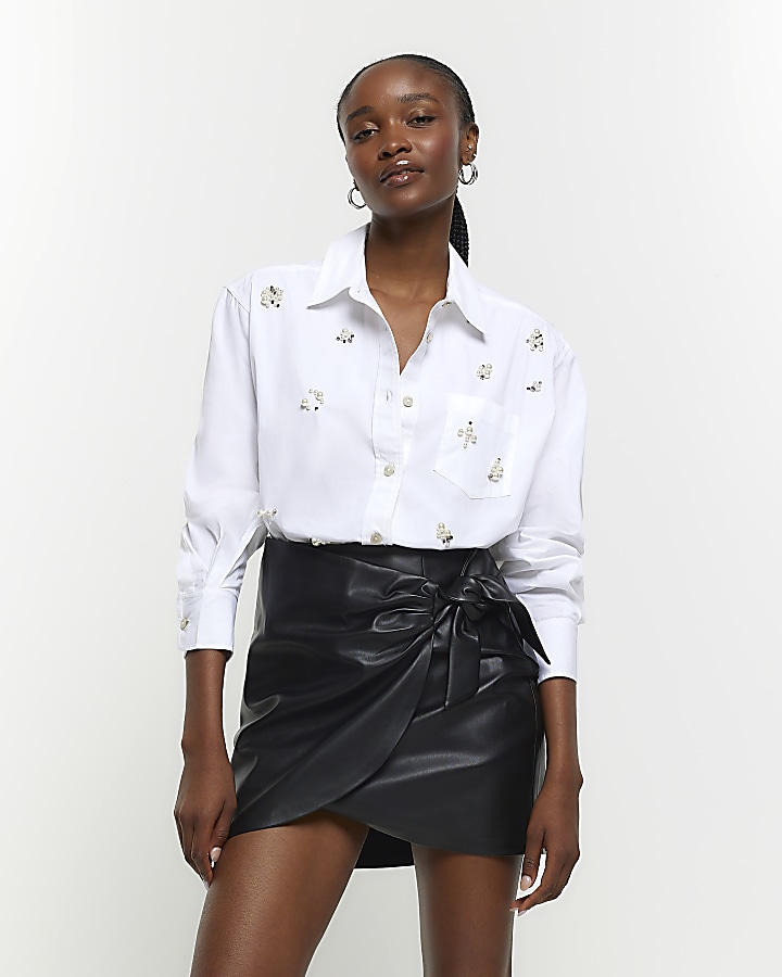Black faux leather bow mini skirt | River Island