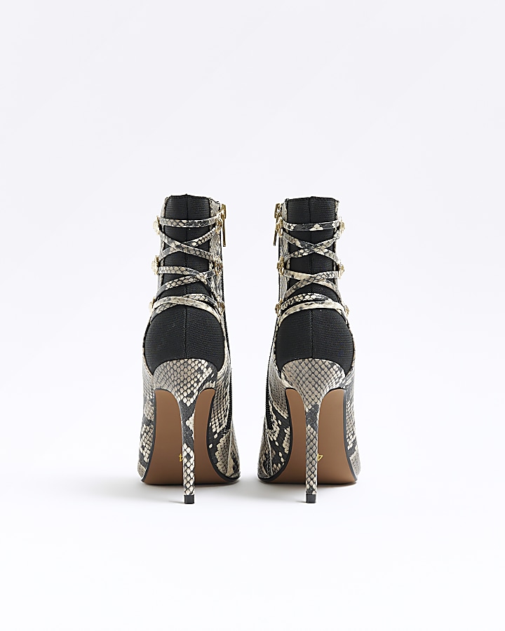 Beige animal print tie up heeled boots
