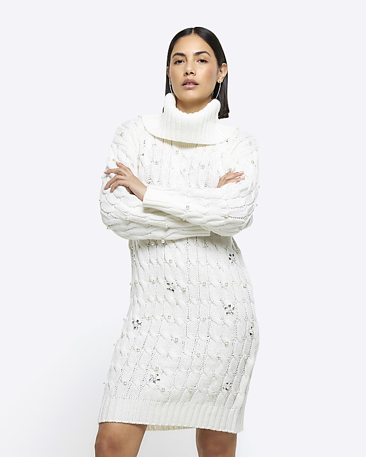 The Frolic cable knit roll neck mini jumper dress in cream