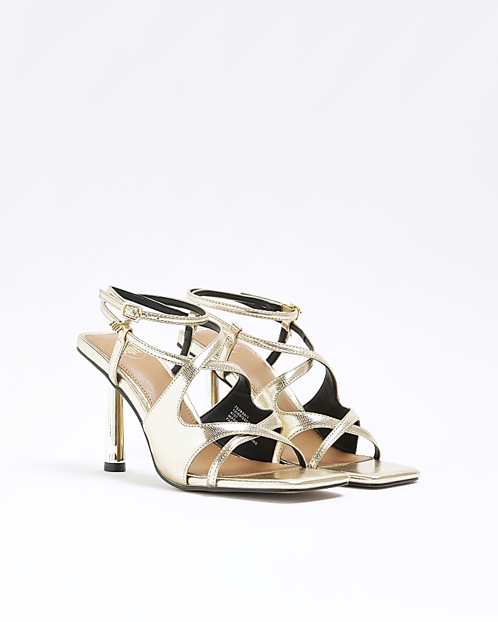 Gold cross over heeled sandals
