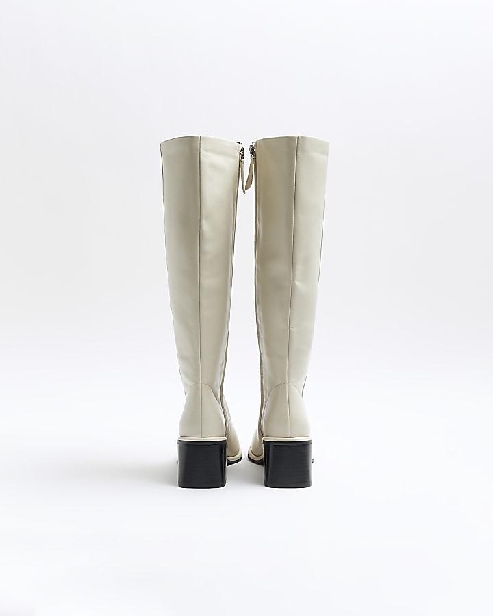 Cream high leg heeled boots