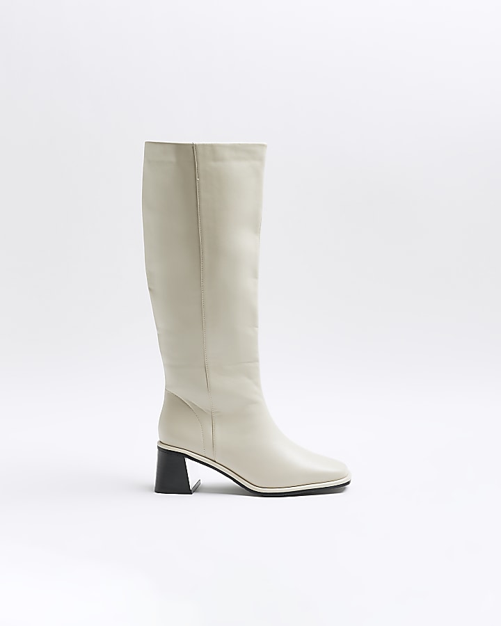 Cream high leg heeled boots