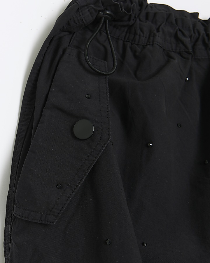 Black drawstring cuff parachute trousers