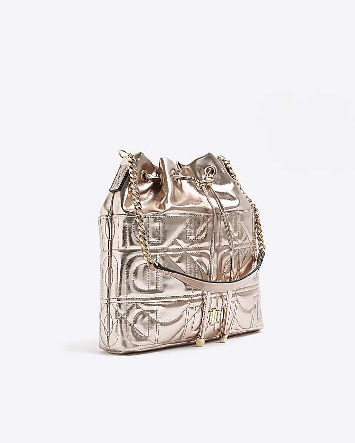 Gold quilted drawstring shoulder bag