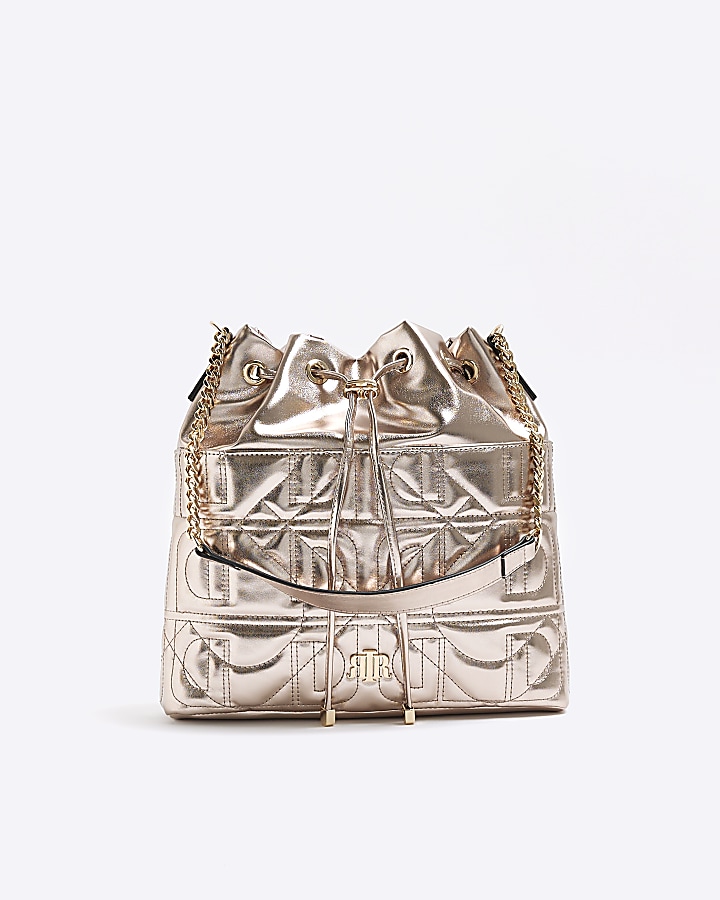 Gold quilted drawstring shoulder bag River Island