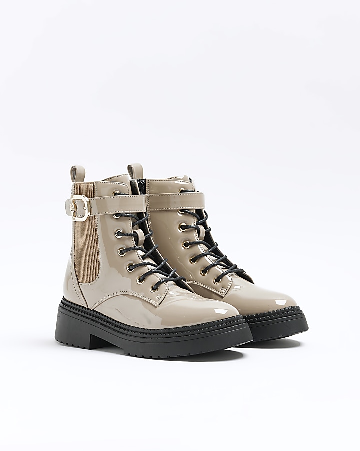 Beige patent buckle lace up boots