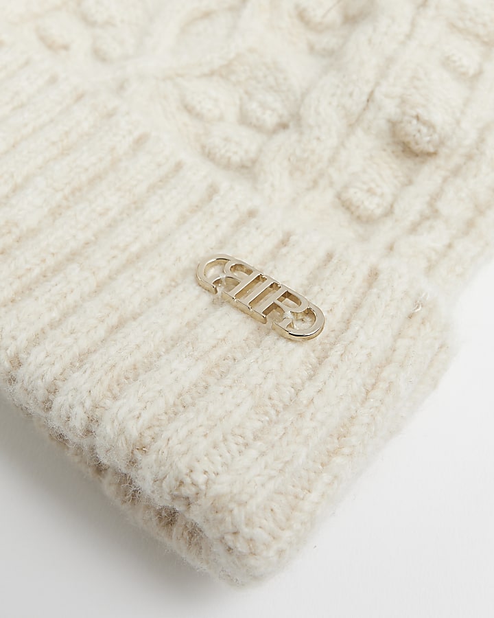 Beige cable knit beanie hat | River Island