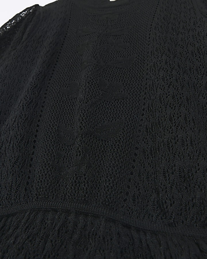 Black knitted puff sleeve peplum top